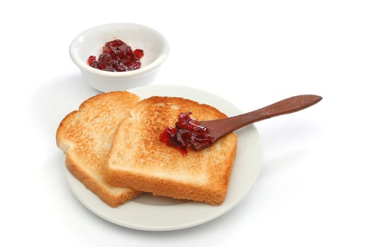 Two toast on a plate with red jam behind. Deliciuos food for breakfast.  Look at my gallery for more meals