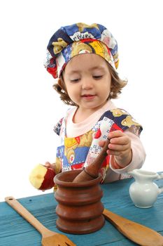 Cute toddler cooking dressed as a chef. More pictures of this baby at my gallery
