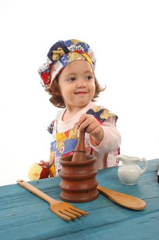 Cute toddler cooking dressed as a chef. More pictures of this baby at my gallery
