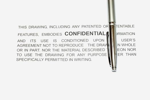 Confidential Information statement on a white backgound with pen