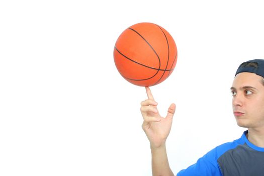 Young man playing basketball isolated. Funny expression From my sport series.