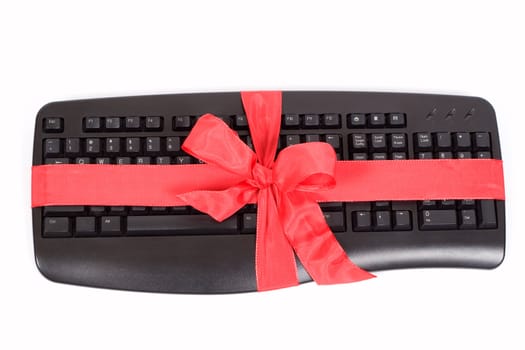 christmas gift - keyboard with red ribbon