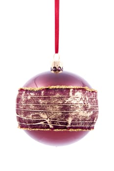 Christmas glass ball in maroon colour with decorative ribbon isolated on white