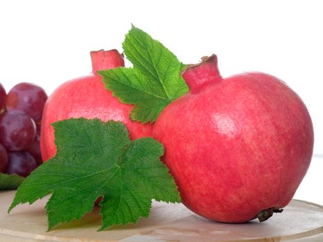 Pomegranate fruit, isolated on white background  