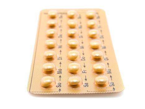 tablets (Birth Control Pills) on a white background 