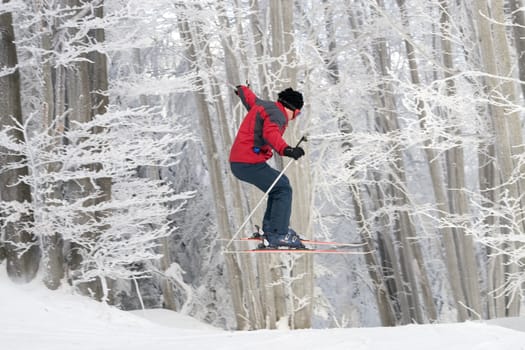 Skier is jumping on ski slope