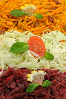 Grated carrots, beetroot and white cabbage salad