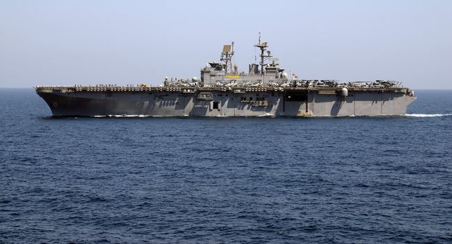 An Amphibious Assault Ship cruises the waters of the Persian Gulf