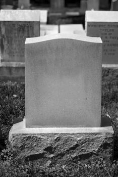 A blank tombstone in a cemetery