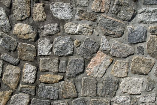 A textured stone wall provides a randomly patterned background