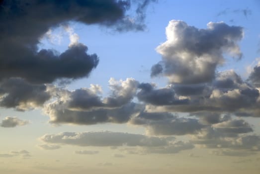 A bright blue summer sky filled with white clouds