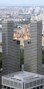 A densely packed urban view, frame by a unique set of twin skycrapers