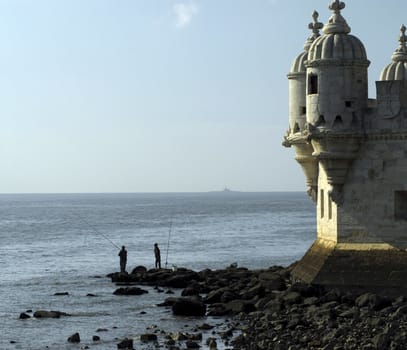 A Pair of fishermen enjoy a lovely sunny day in Portugal