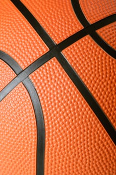 A macro background image of the texture of a basketball. Focus is in the middle.
