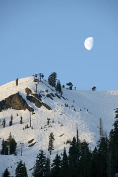 A scenic mountain moonscape shot at dawn
