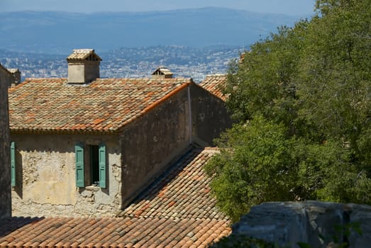 A lovely villa with a red terrocota roof overlooks the French countryside