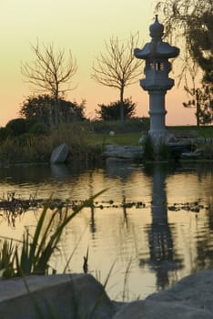 A peaceful and tranquil Japanese garden at sunset