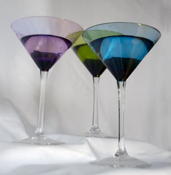 3 colorful martini glasses against a white background