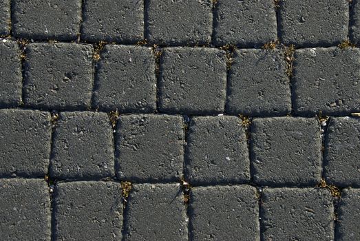 A wall of tightly packed black bricks