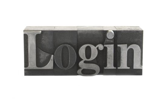 old metal letterpress letters form the word 'login' isolated on white