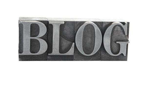 old metal letterpress letters form the word 'blog' isolated on white