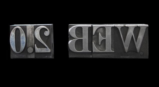 old metal letterpress letters form the term 'web 2.0' isolated on white
