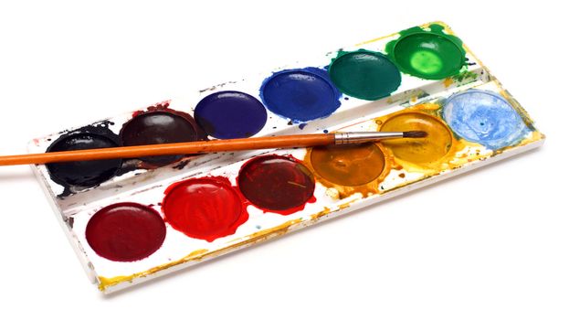 set of water-colour paints and brush isolated on white