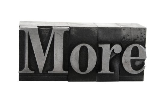 old metal letterpress letters form the word 'more' isolated on white