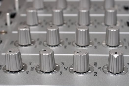 controls of dj music mixer close-up