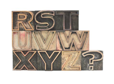 old, ink-stained letterpress wood outline type letters R-Z with question mark