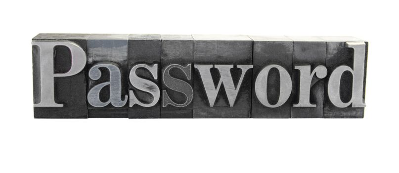 old, ink-stained metal letterpress type spells out the word 'Password' isolated on white