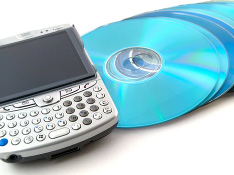 CDs DVDs and Mobile Phone PDA on White Background