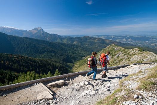 Couple is trekking in mountains. Tatra Mountains, Poland