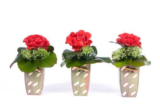 Arrangement with red rose in flower vases