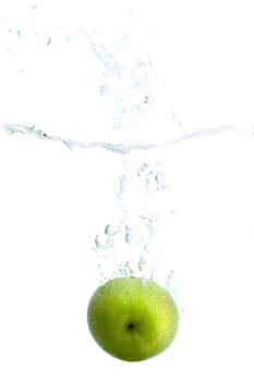 Big green apple splashing in water