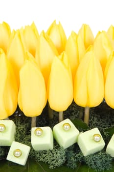 Yellow tulips and decoration with pearls