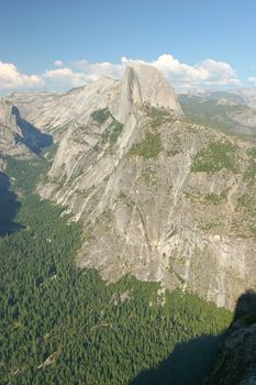 Glacier Point is a viewpoint above Yosemite Valley, in California, USA. It is located on the south wall of Yosemite Valley at an elevation of 7,214 ft (2,199 m), 3,200 ft (975 m) above Curry Village. The point offers a superb view of Yosemite National Park, including Yosemite Falls, Half Dome, Vernal Falls, Nevada Falls, and Clouds Rest.