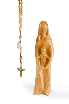 Wooden madonna figure with rosary - isolated on white background
