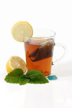 Peppermint tea in a glass - isolated on white background