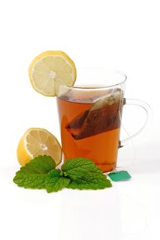 Peppermint tea in a glass on bright background