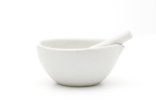 White mortar and pestle over white background