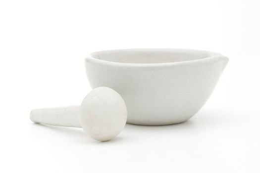 White mortar and pestle over white background