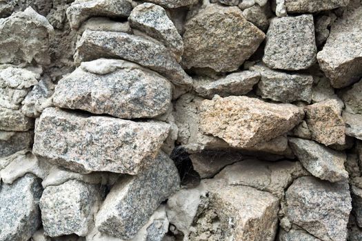 Granite masonry. A stone wall close up.