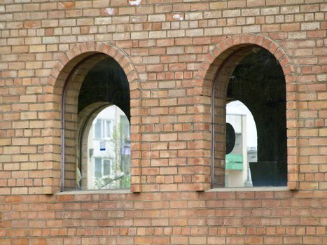 Two arcs at the bricks wall of the modern building