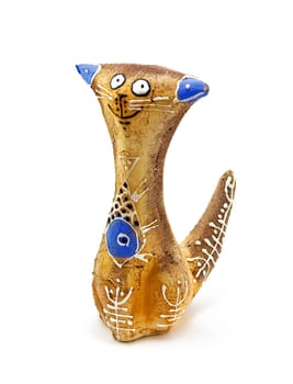 A figurine of a playful cat, made of clay and hand painted