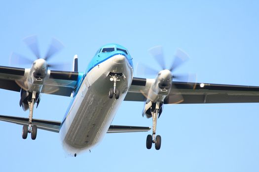 A propelor plane approaching the runway