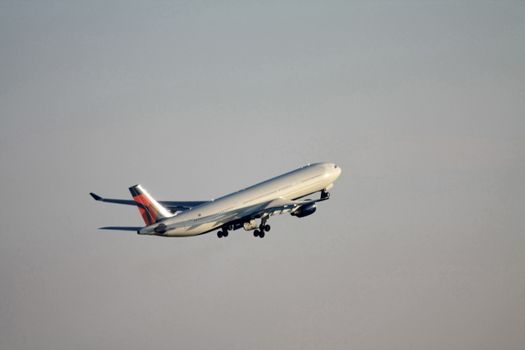 An airplane, seconds after the take off