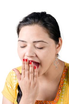 Tired young beautiful female taking yawning over white background 