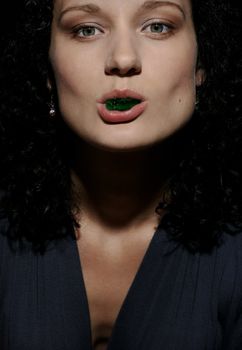 Portrait of girl with jelly pastille in lips