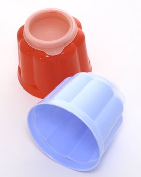 blue and red jelly moulds for single servings of food